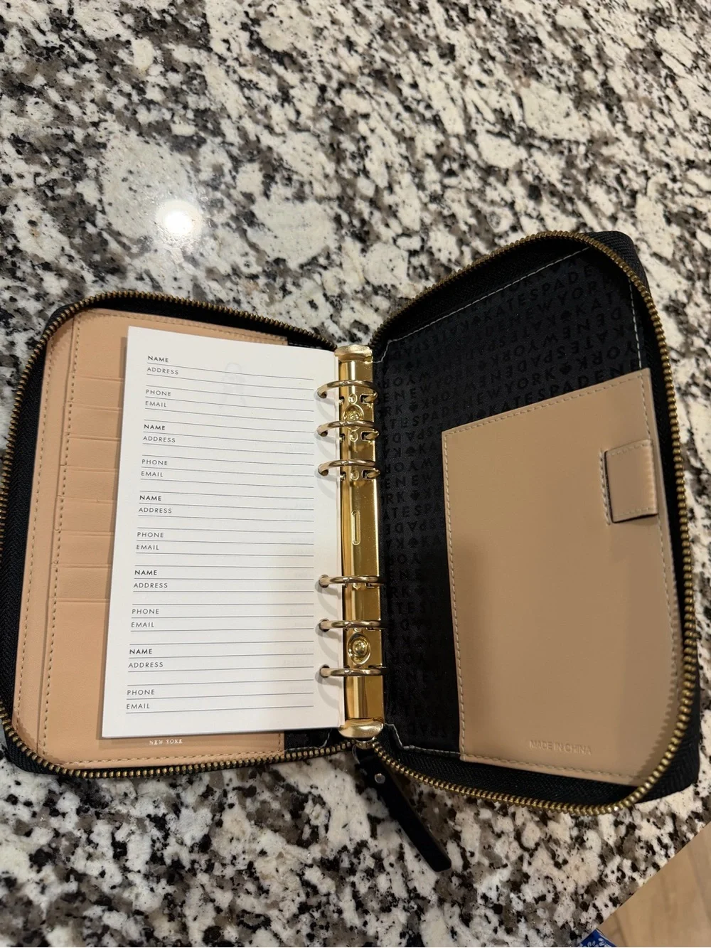 kate spade Black Pebbled Leather Zip Wallet with Gold Logo